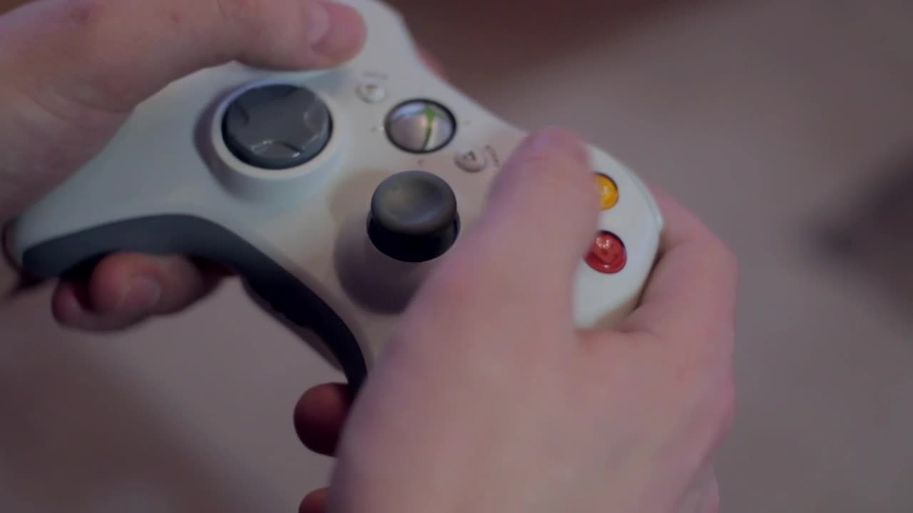 Download Stock Video Hands Playing With A Video Game Controller Animated Wallpaper