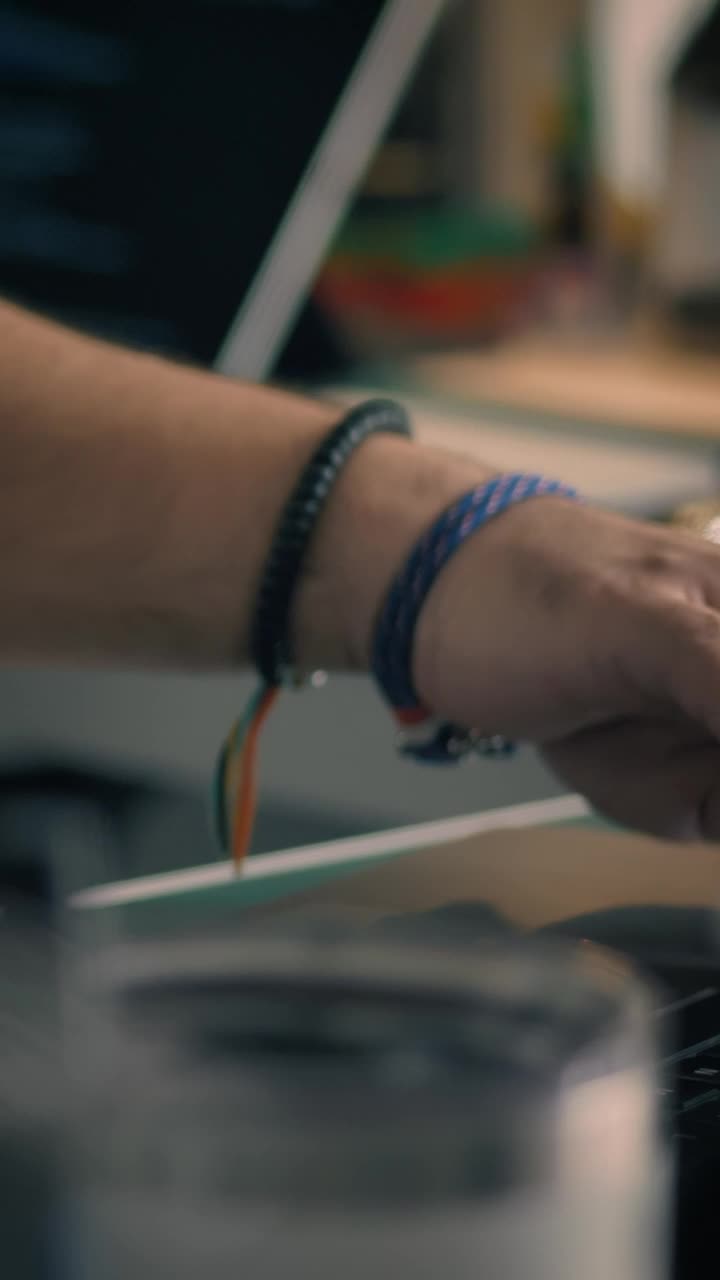 Download Stock Video Hands Of An Engineer Programming On A Pair Of Computers Animated Wallpaper