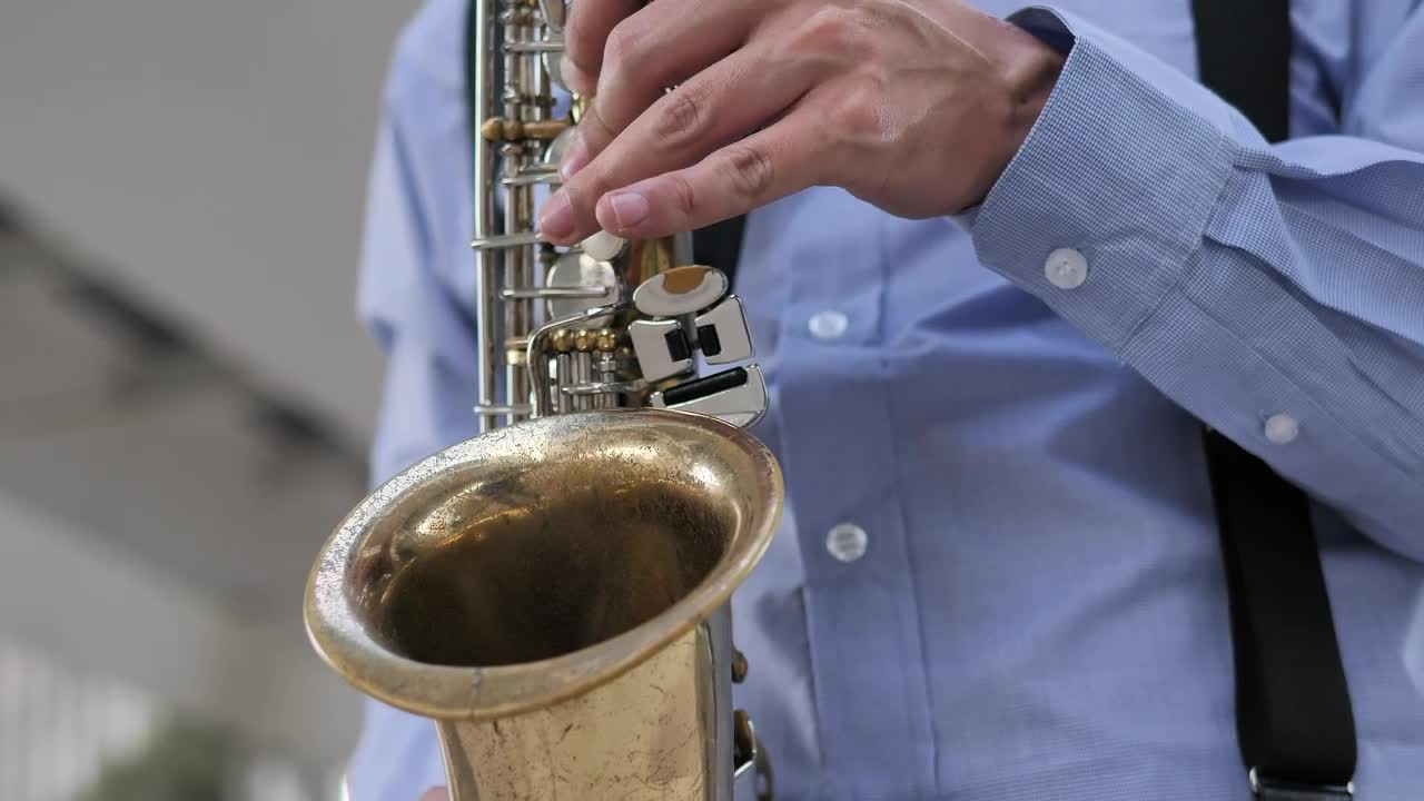 Download Stock Video Hands Of A Saxophonist Playing A Song Animated Wallpaper