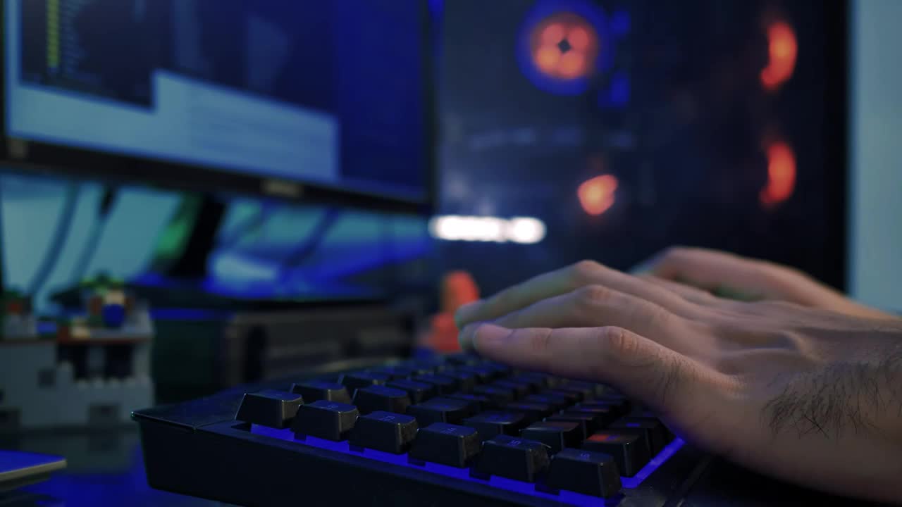 Download Stock Video Hands Of A Programmer Working On His Computer Animated Wallpaper