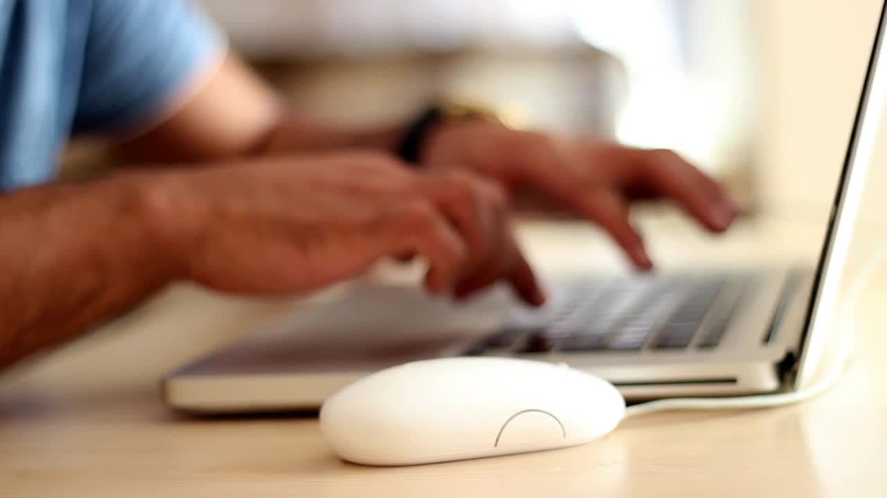 Download Stock Video Hands Of A Man Working On A Computer Animated Wallpaper