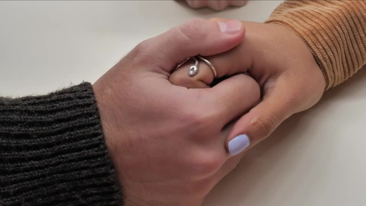 Download Stock Video Hands Of A Loving Couple Animated Wallpaper