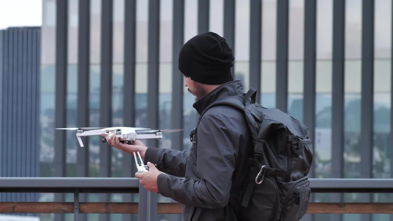 Download Stock Video Man Holding A Drone Animated Wallpaper