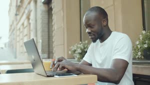 Download Stock Video Man Gets Emotional While Chatting Online Outside Ith Laptop Animated Wallpaper
