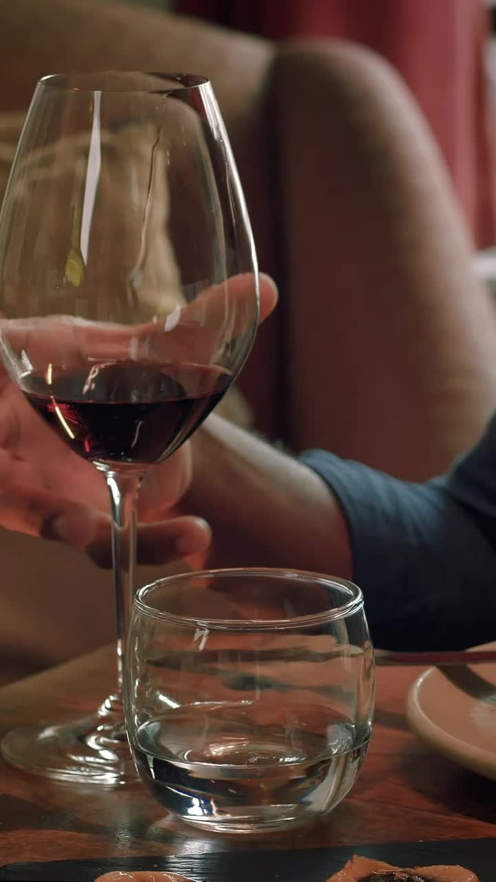 Download Stock Video Man Drinking Wine From A Glass At A Romantic Dinner Animated Wallpaper