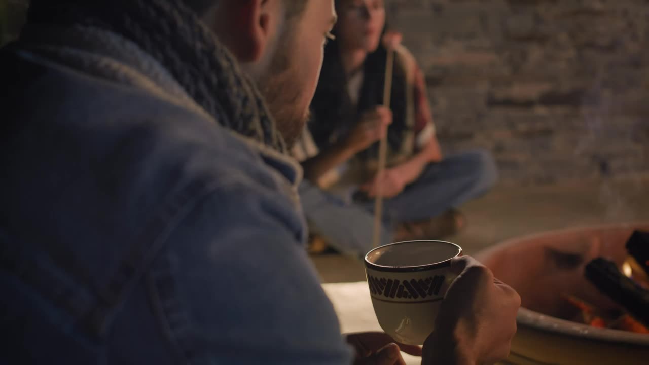 Download Stock Video Man Drinking Homemade Coffee On A Campfire Night Animated Wallpaper