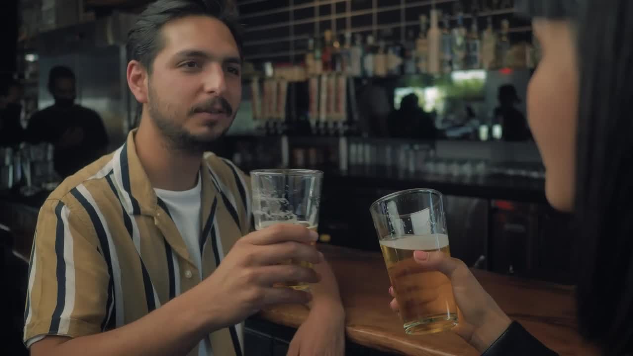 Download Stock Video Man Drinking Beer With His Date Animated Wallpaper