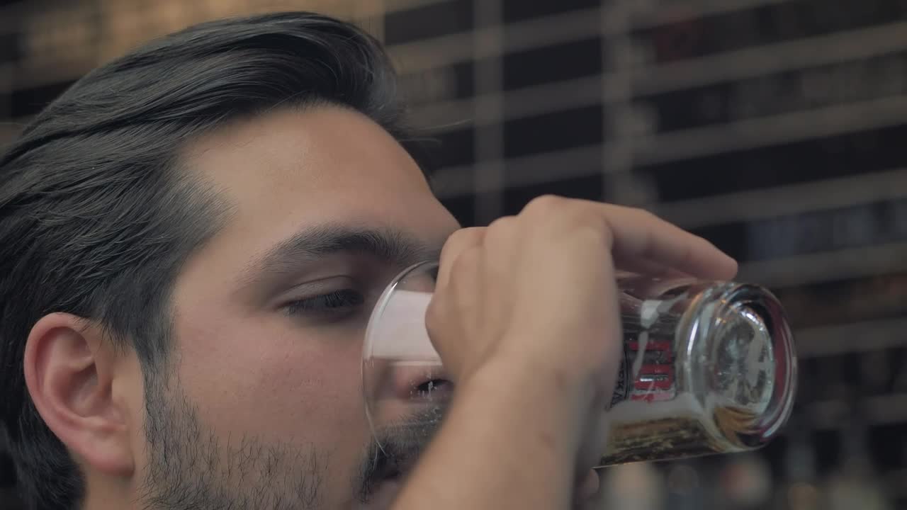 Download Stock Video Man Drinking Beer From A Glass Animated Wallpaper