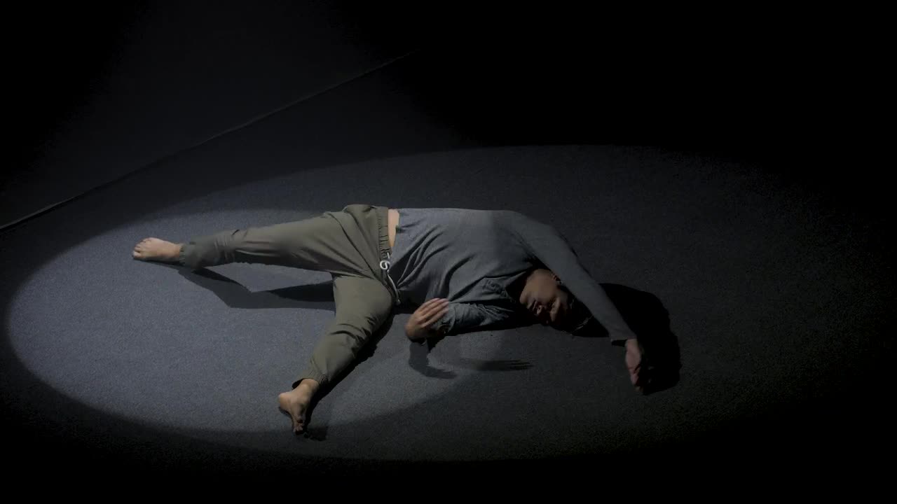 Download Stock Video Man Doing Floor Performance In The Dark Animated Wallpaper