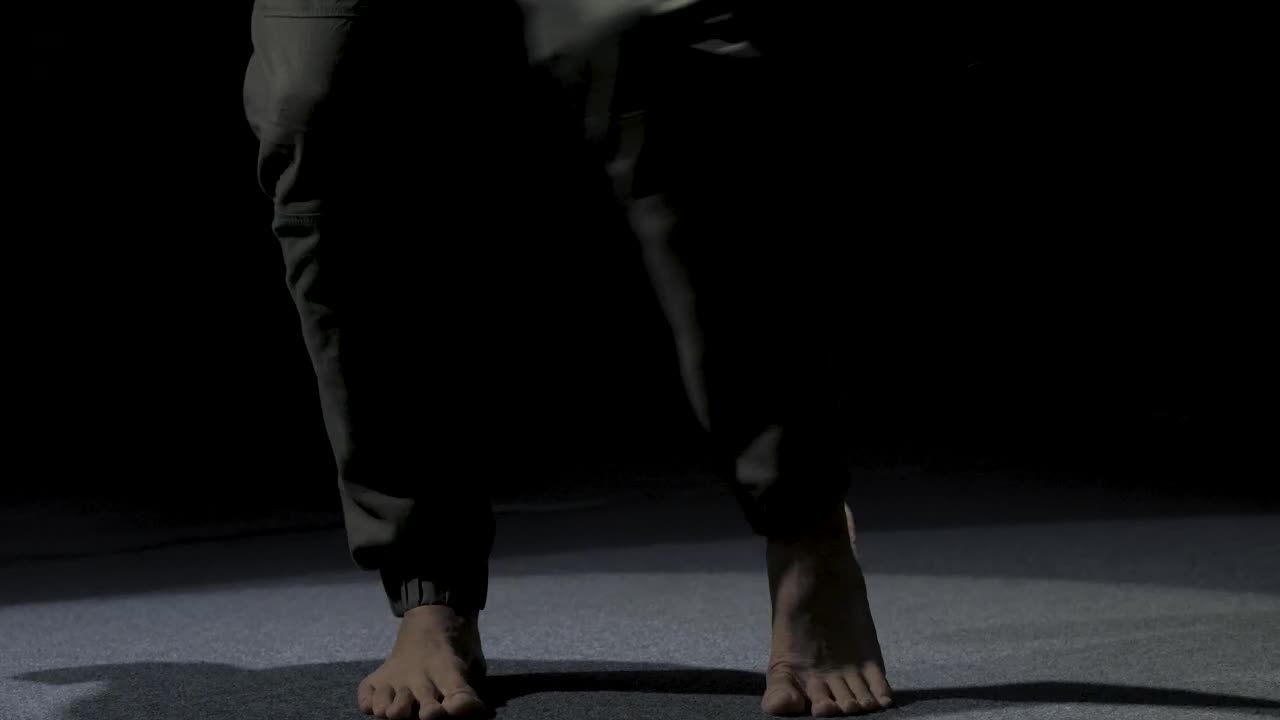 Download Stock Video Man Dancing Barefoot In The Dark Animated Wallpaper