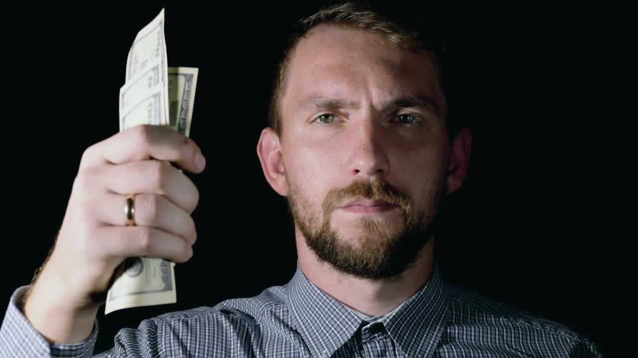 Download Stock Video Man Crumples Dollar Bills And Throws Them Away Animated Wallpaper