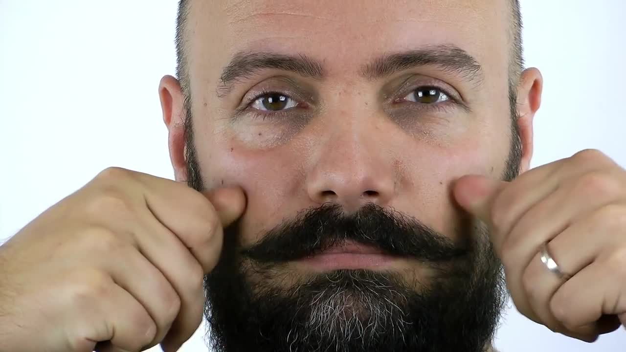 Download Stock Video Man Combing His Mustache Animated Wallpaper