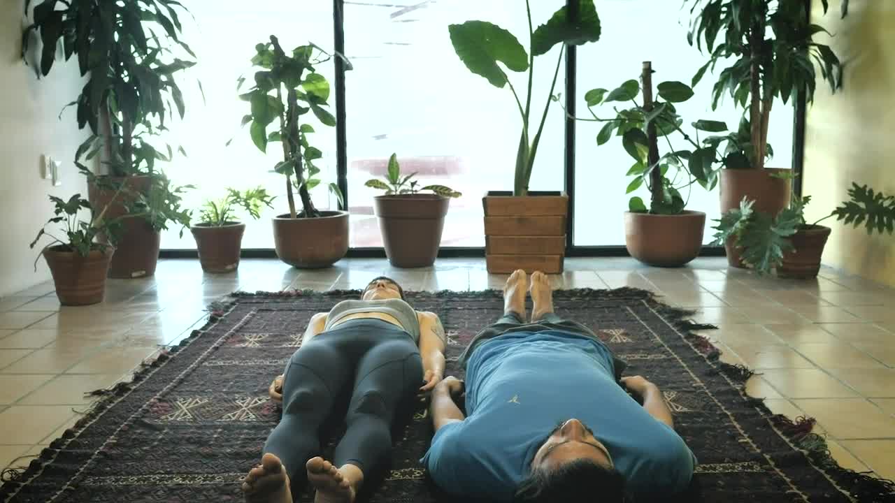 Download Stock Video Man And Woman In Sitting Yoga Pose Animated Wallpaper