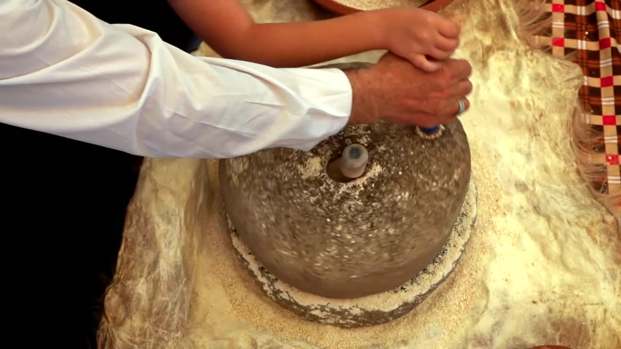 Download Stock Video Making Wheat Flour In A Rotating Stone Animated Wallpaper