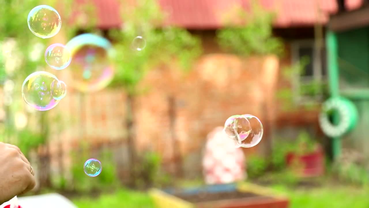 Download Stock Video Making Bubbles With Soap Animated Wallpaper