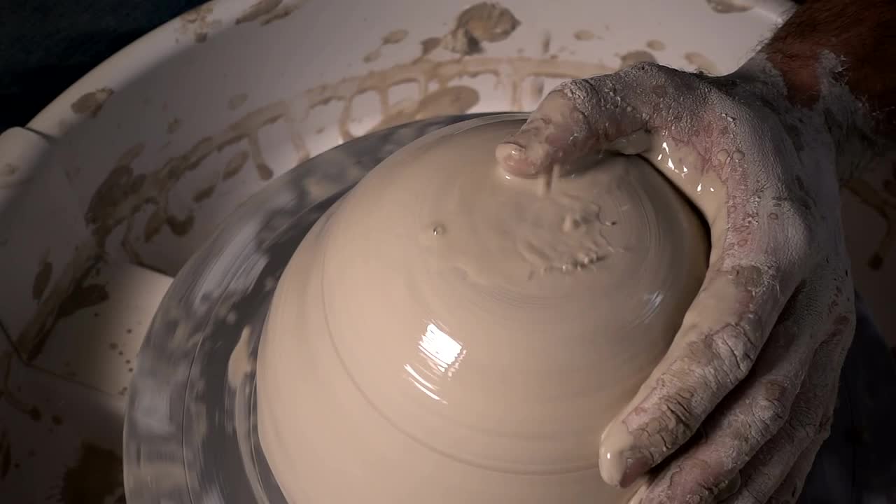 Download Stock Video Making A Clay Bowl In The Workshop Animated Wallpaper