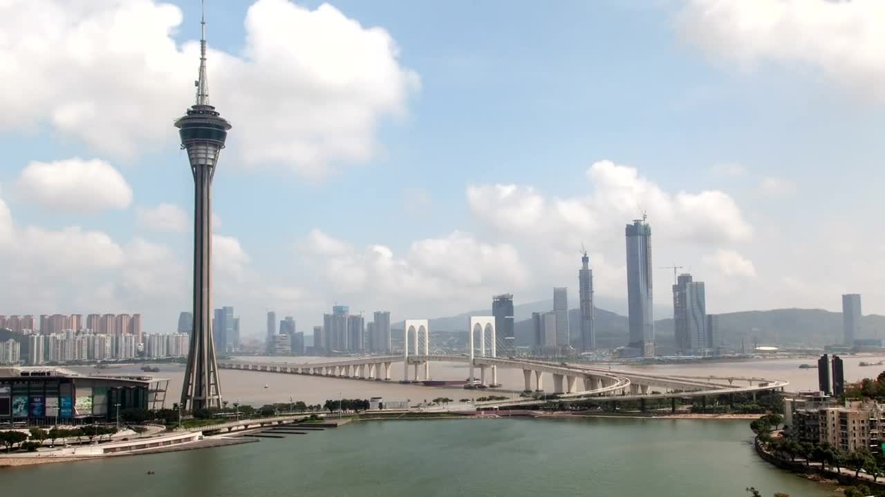 Download Stock Video Macau Tower And Bridge With City In The Background Animated Wallpaper