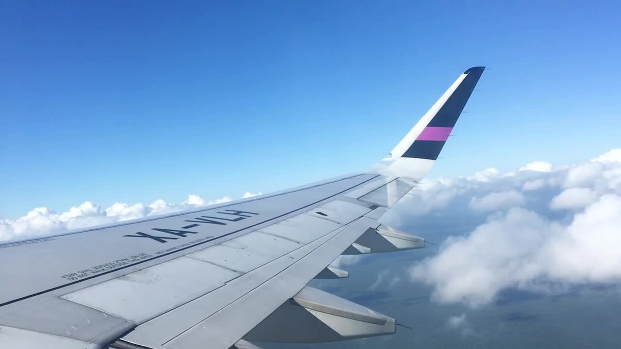 Download Stock Video Looking At The Sky From The Window Of An Airplane Animated Wallpaper