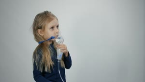 Download Stock Video Little Girl Breathing With Inhalation Device Animated Wallpaper