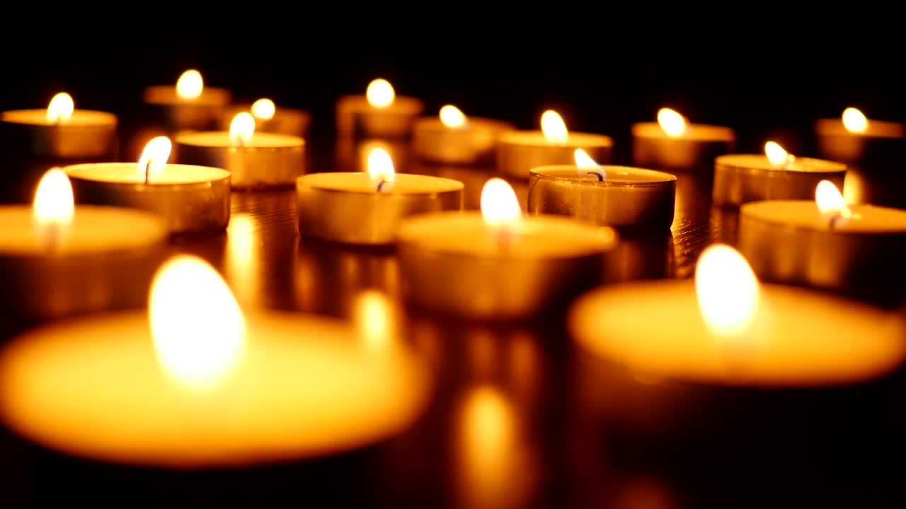 Download Stock Video Little Candles Burning In The Dark Animated Wallpaper