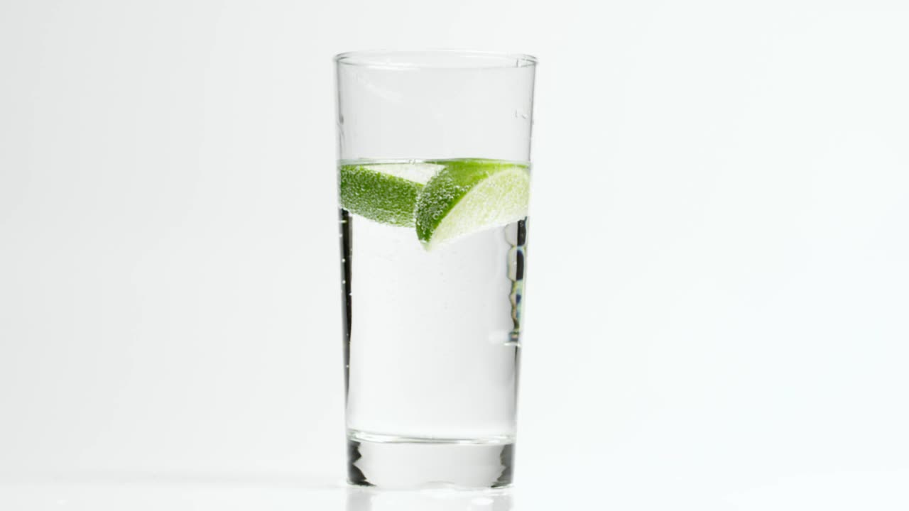 Download Stock Video Lime In A Sparkling Drink Animated Wallpaper