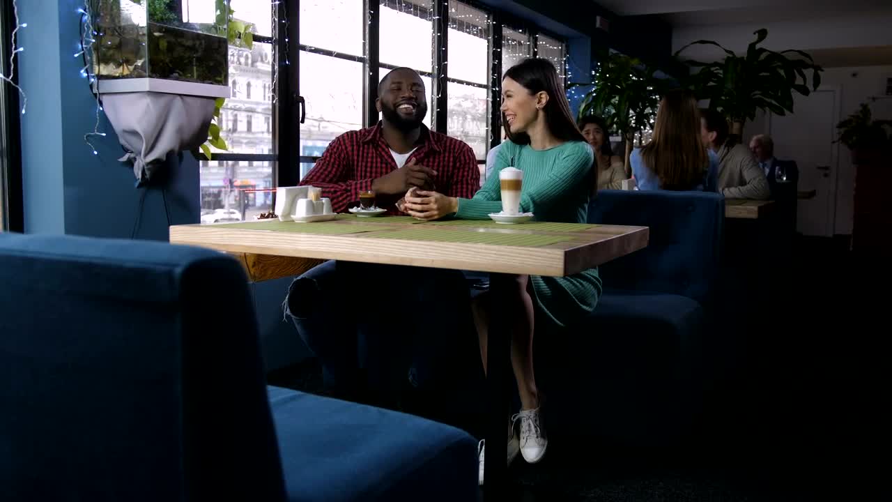 Download Stock Video Laughing Couple In A Coffee Shop Animated Wallpaper