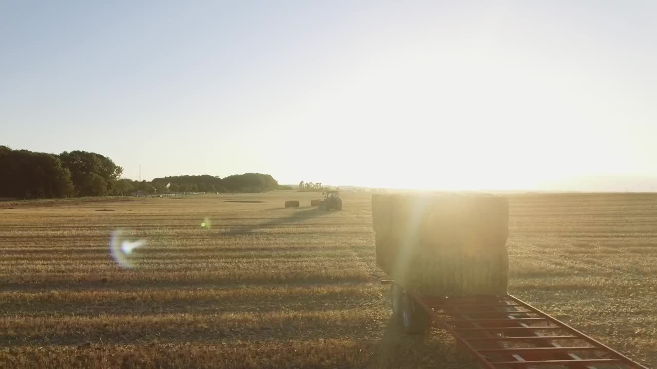 Download Stock Video Large Hay Bales In A Field Animated Wallpaper