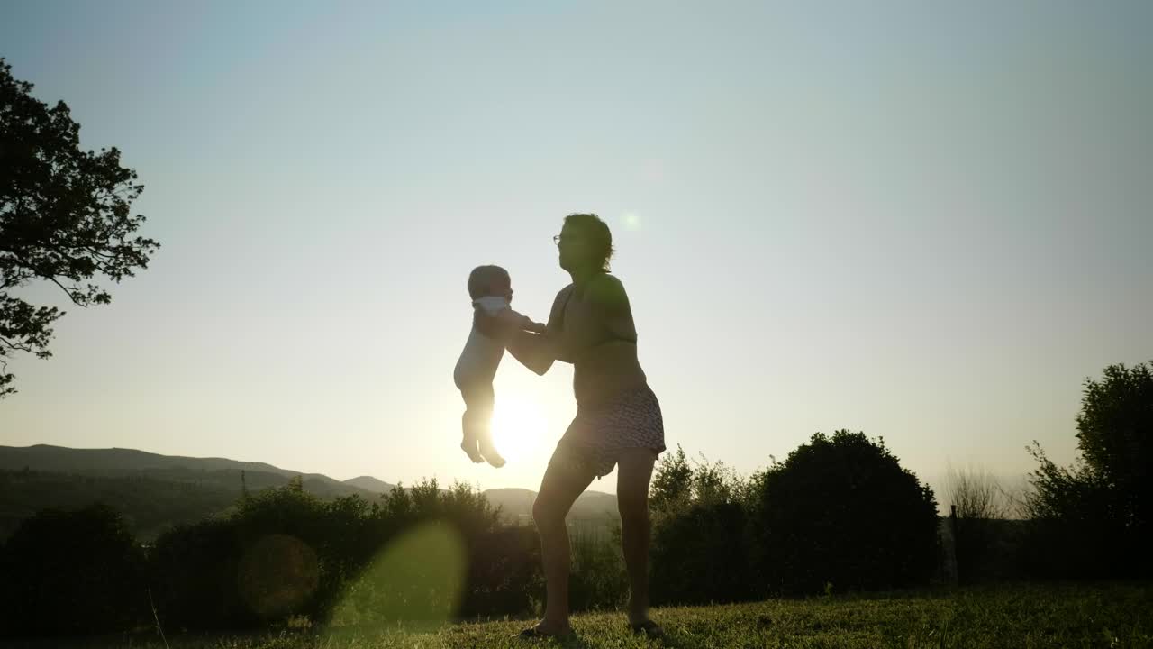 Download Stock Video Mother Spinning Her Bab Animated Wallpaper