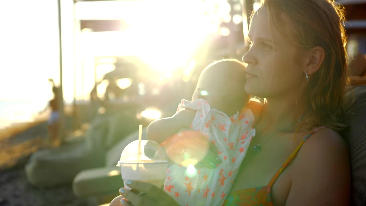 Download Stock Video Mother Enjoying A Break With Her Bab Animated Wallpaper