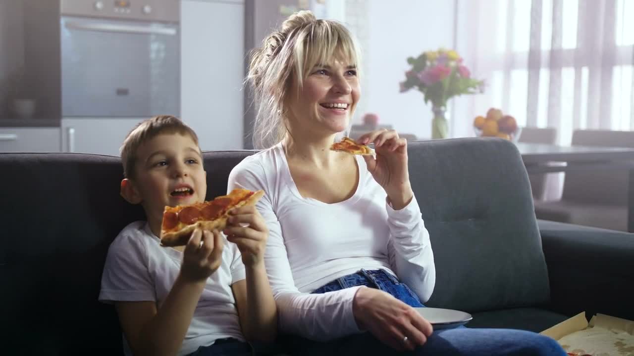 Download Stock Video Mother And Son Eating Pizz Animated Wallpaper