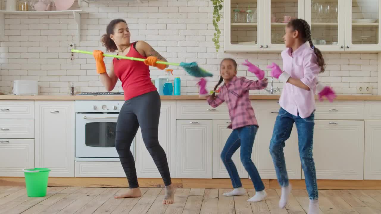 Download Stock Video Mother And Daughters In A Kitchen Dancin Animated Wallpaper