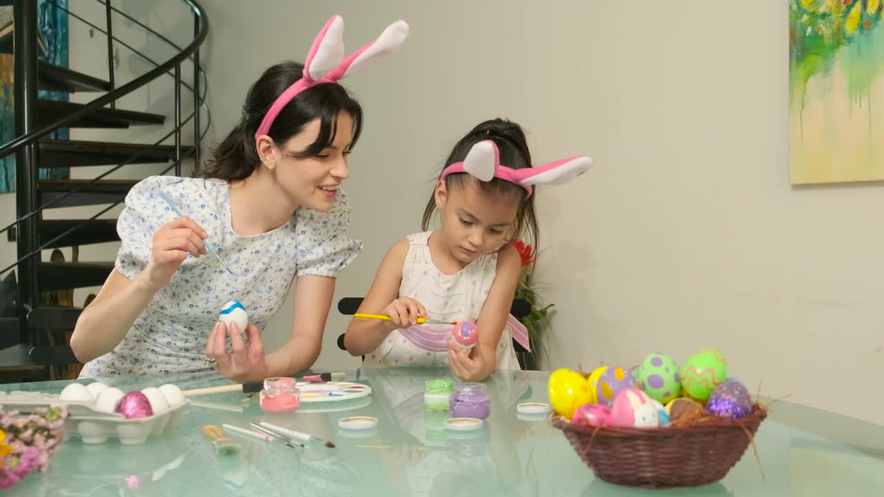 Download Stock Video Mother And Daughter Preparing Easter Egg Animated Wallpaper