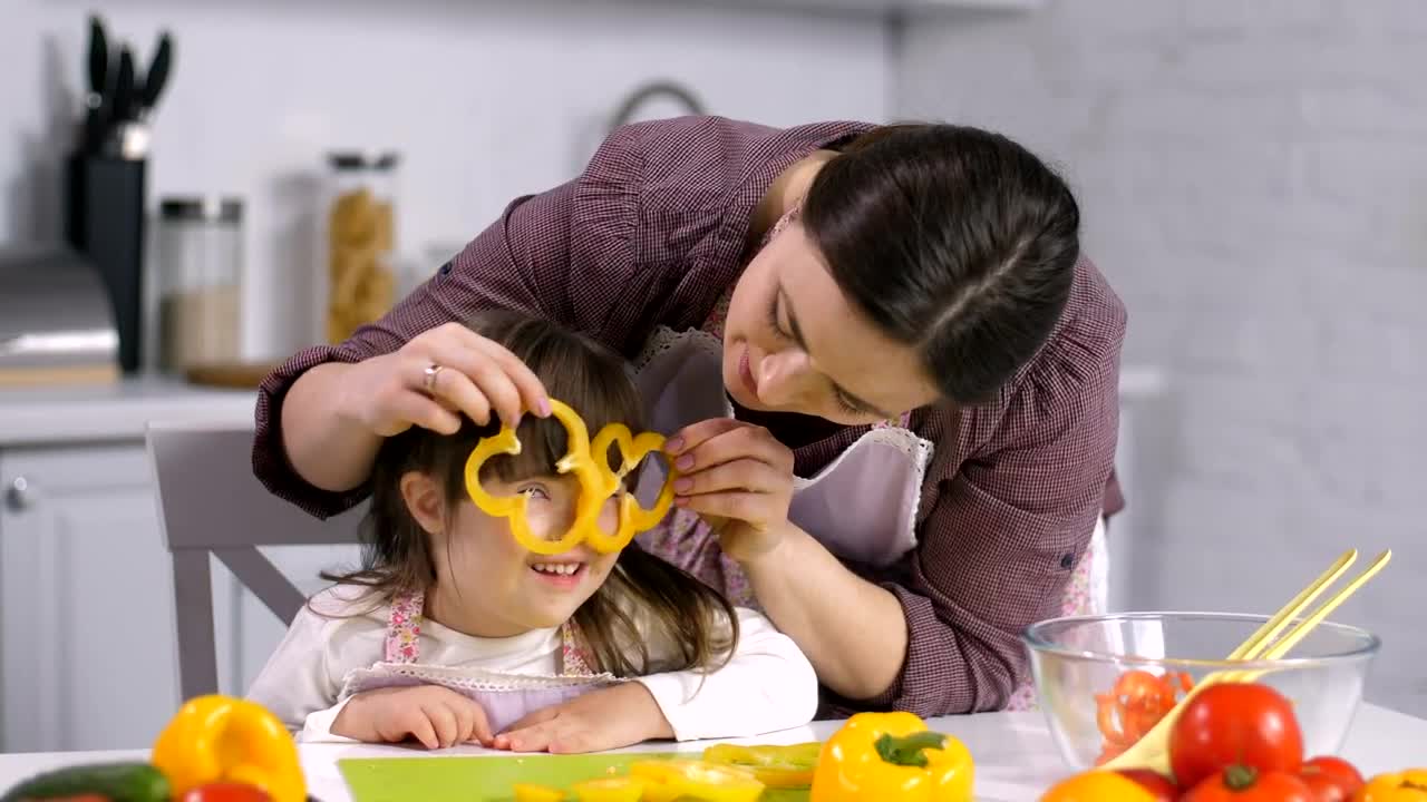 Download Stock Video Mother And Daughter In The Kitche Animated Wallpaper