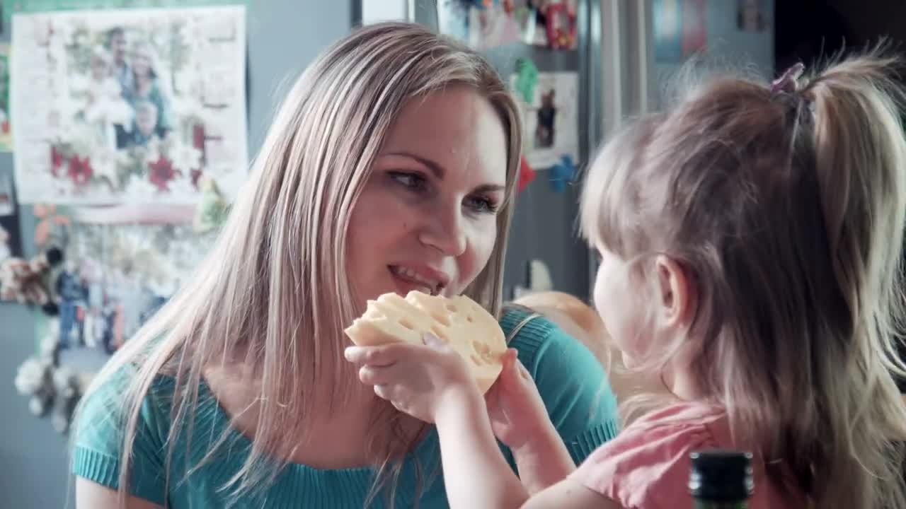 Download Stock Video Mother And Daughter Hug In The Kitche Animated Wallpaper