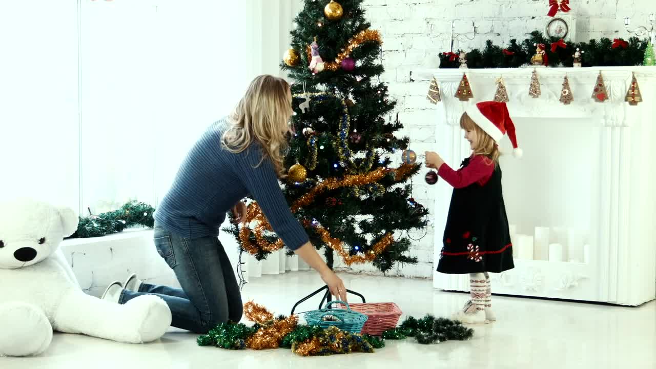 Download Stock Video Mother And Daughter Decorating The Christmas Tre Animated Wallpaper