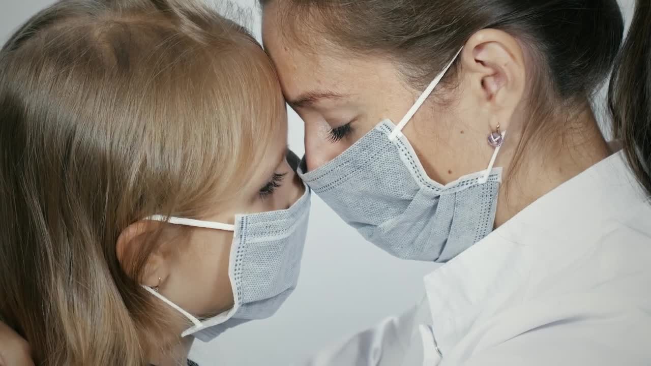 Download Stock Video Mother And Daughter Crying With Facemask Animated Wallpaper