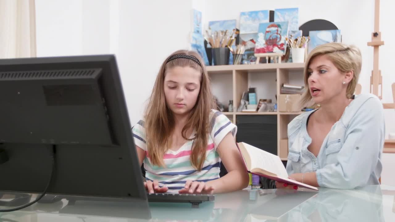 Download Stock Video Mom Helping Girl Learn Computer Skill Animated Wallpaper