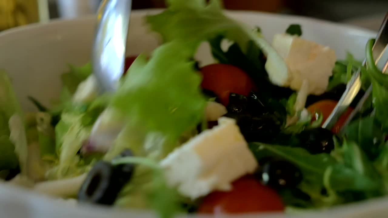 Download Stock Video Mixing A Salad Ready For Serving Guest Animated Wallpaper