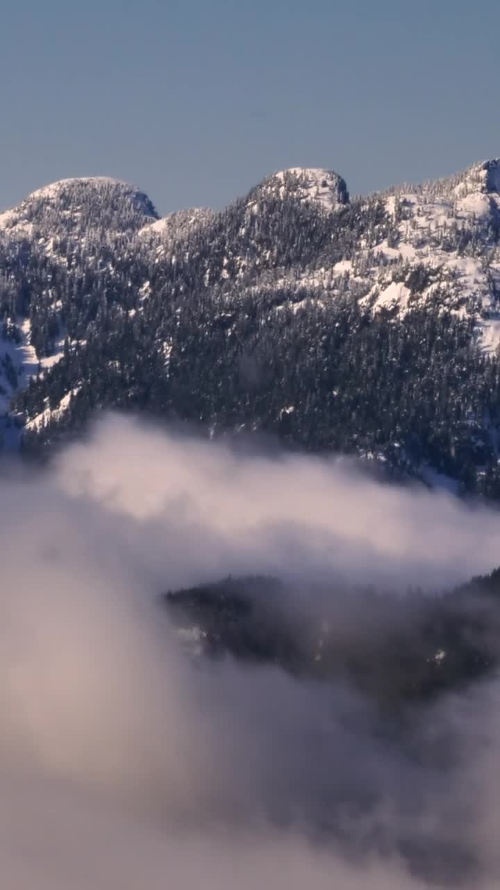 Download Stock Video Mist At The Base Of A Snowy Mountai Animated Wallpaper