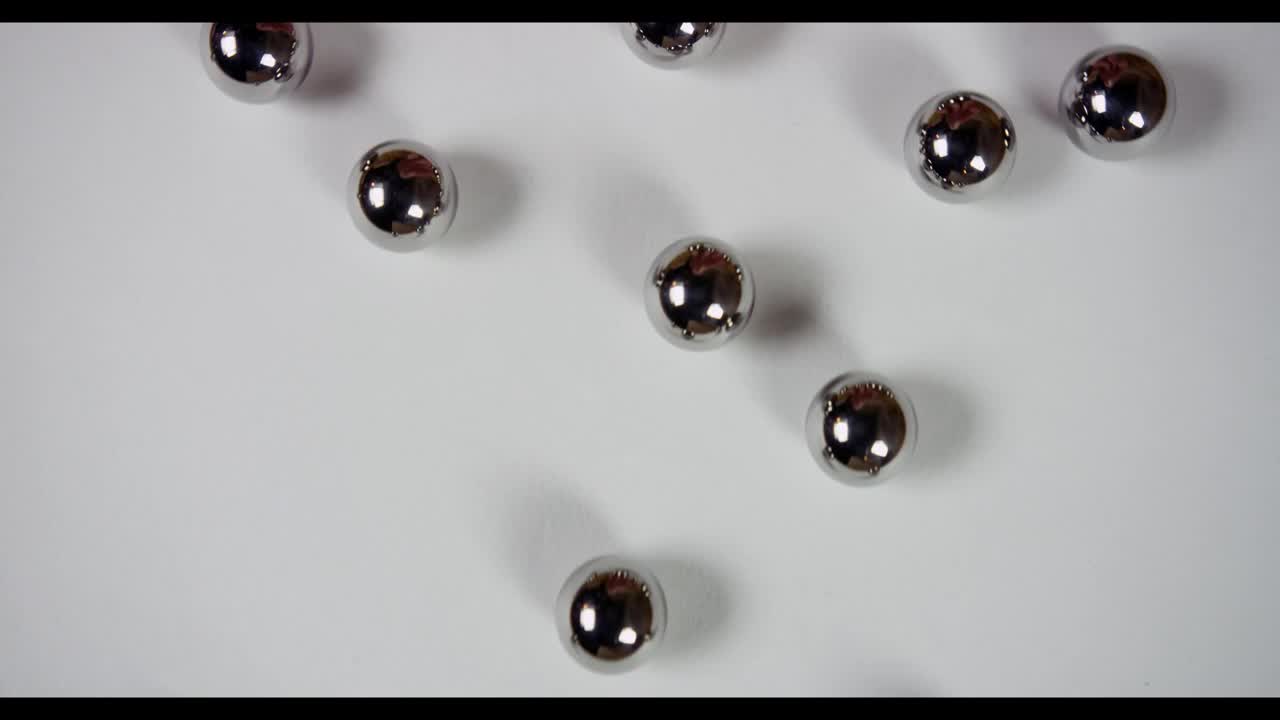 Download Stock Video Metal Pellets Roll From Bottom To To Animated Wallpaper