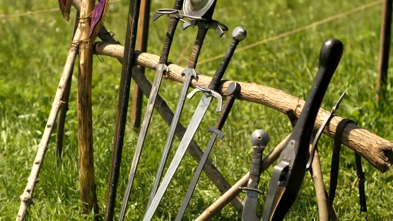 Download Stock Video Medieval Swords In The Gras Animated Wallpaper