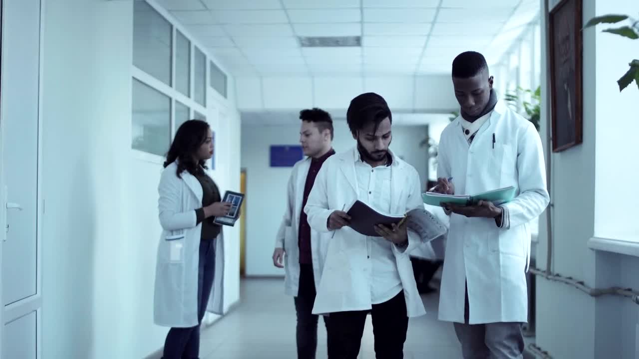 Download Stock Video Medical Students Converse In The Hal Animated Wallpaper