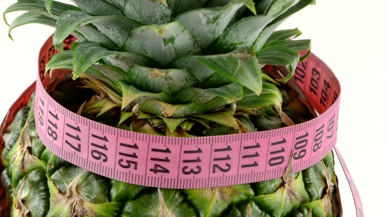 Download Stock Video Measuring Tape Rounding A Pineappl Animated Wallpaper