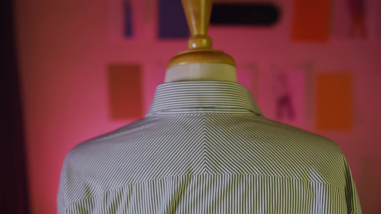 Download Stock Video Measuring A Shirt In A Sho Animated Wallpaper