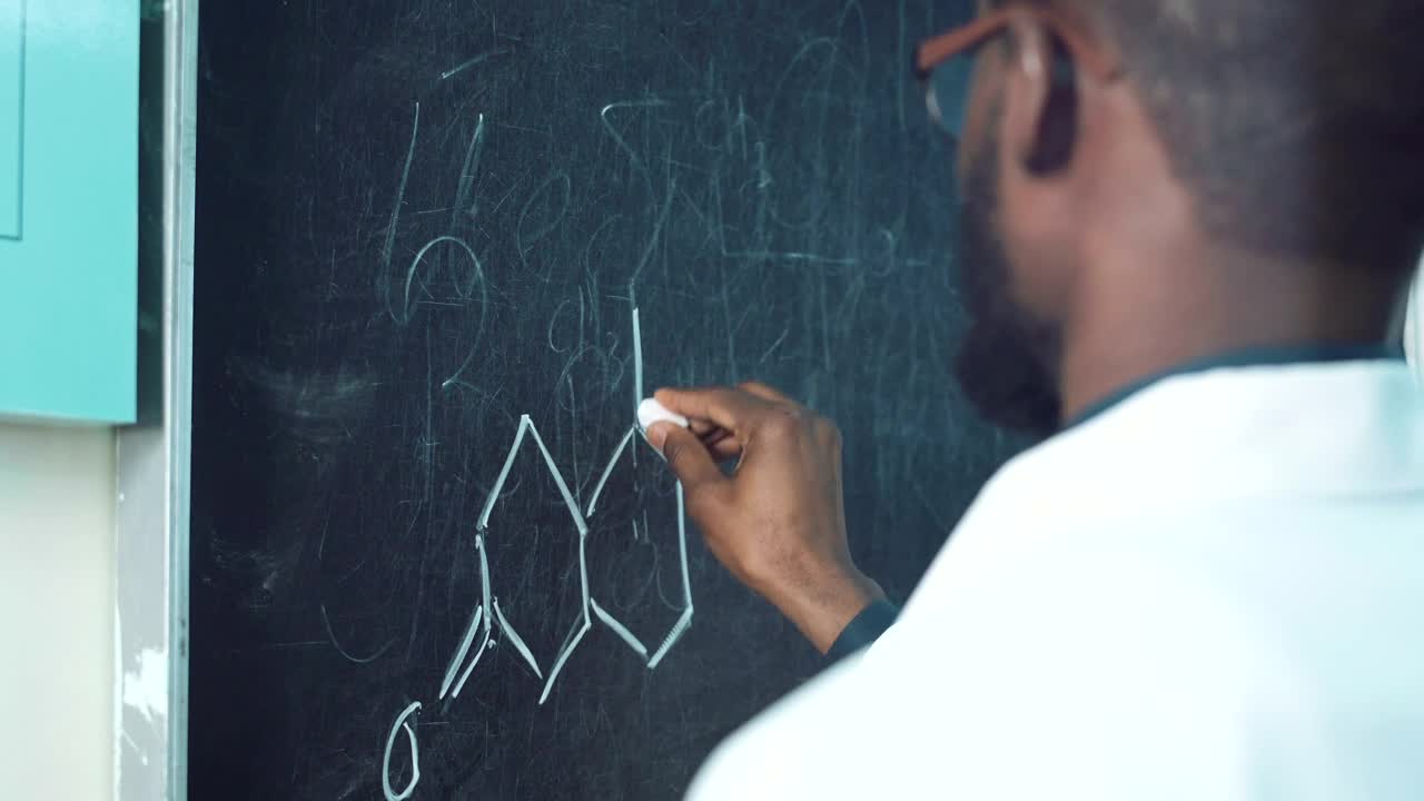 Download Stock Video Man Writing A Chemical Formula On The Blackboar Animated Wallpaper