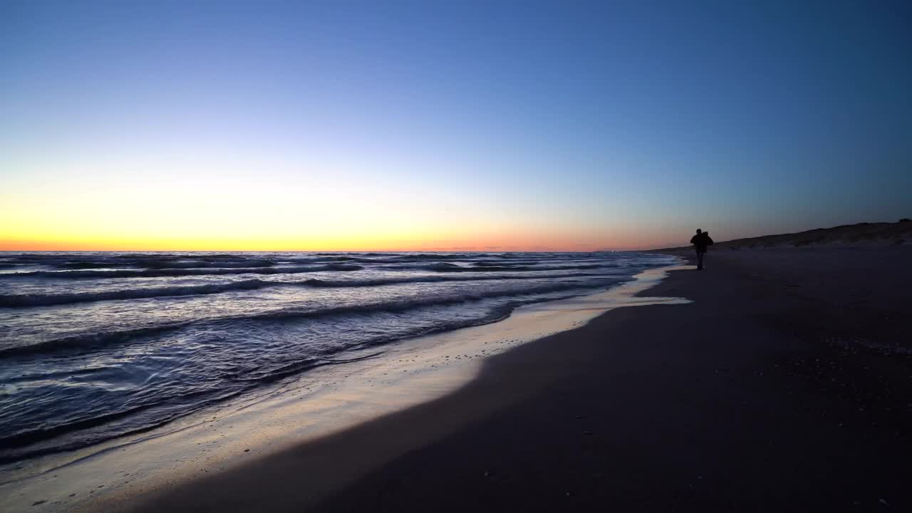 Download Stock Video Man Walking On The Beach With A Backpac Animated Wallpaper