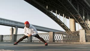 Download Stock Video Man Stretching His Body Before An Urban Workou Animated Wallpaper