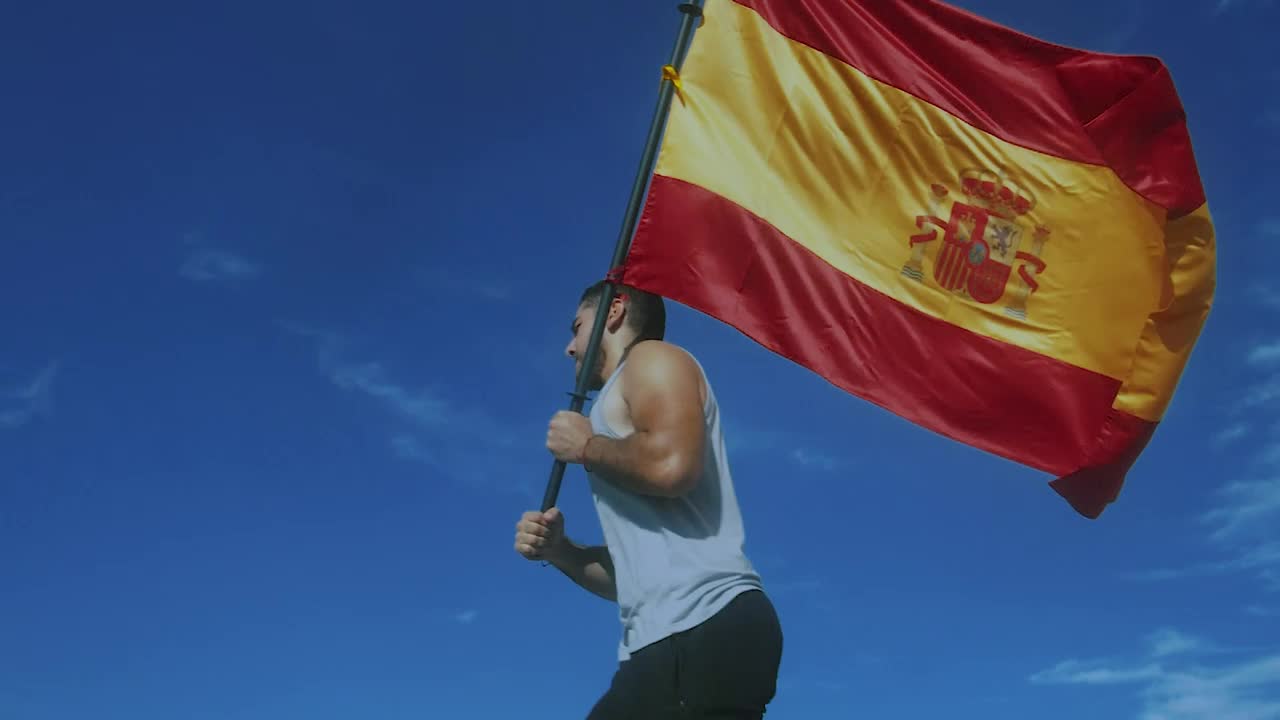 Download Stock Video Man Running With Spanish Fla Animated Wallpaper