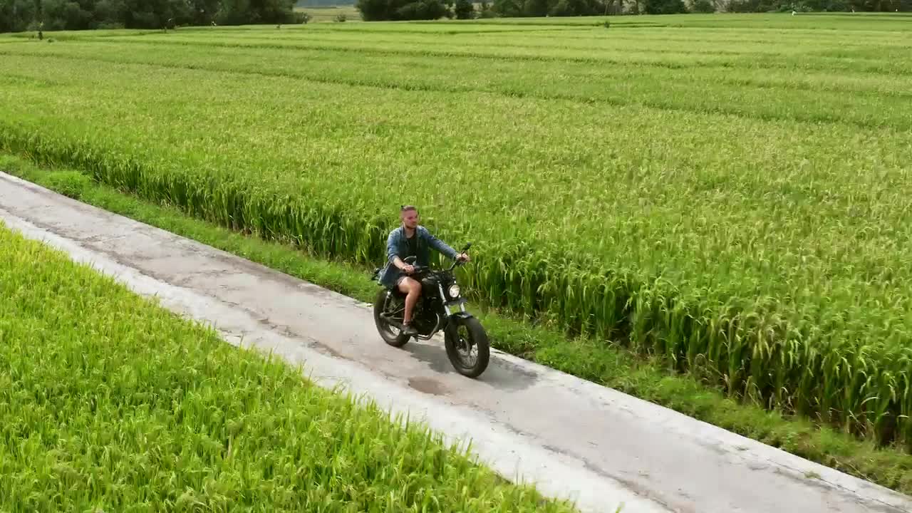 Download Stock Video Man Riding A Motorbike In The Countrysid Animated Wallpaper