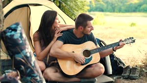 Download Stock Video Man Playing Guitar To His Girlfriend In Cam Animated Wallpaper